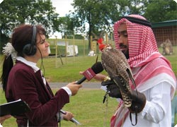 BBC Radio interviews a falconer at an MIA supported cross-cultural festival in Manchester, England. Photo by Kathleen LaCamera